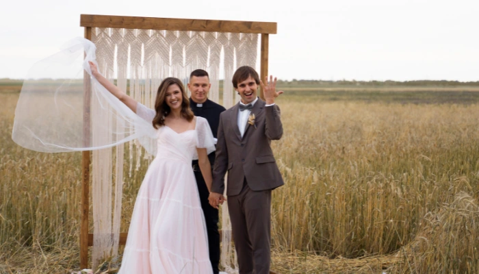 Wedding couple with officiant